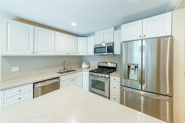 2735 Piedmont Ave Unit 3, Montrose, CA 91020 - kitchen featuring white cabinetry, a sink, and appliances with stainless steel finishes