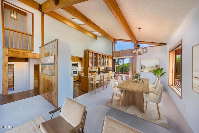 6860 Worth Way, Camarillo, CA 93012 - dining space featuring beamed ceiling, an inviting chandelier, a wealth of natural light, and carpet