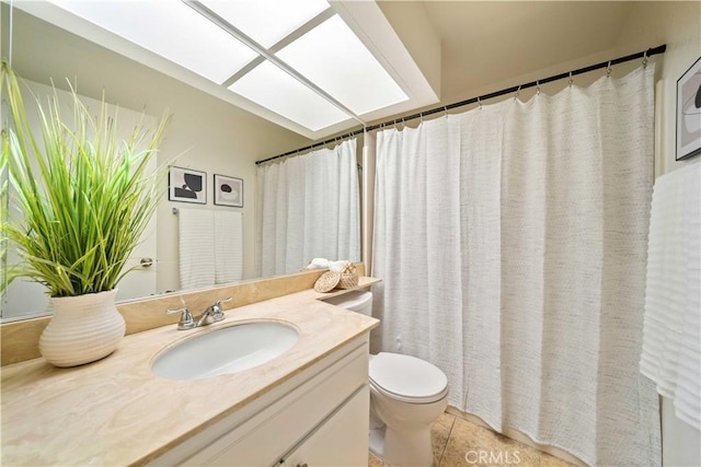 bathroom with toilet, tile patterned flooring, and vanity