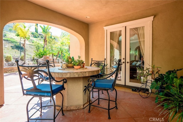 1550 Hibiscus Ave, Azusa, CA 91702 - view of patio with french doors, outdoor dry bar, and fence