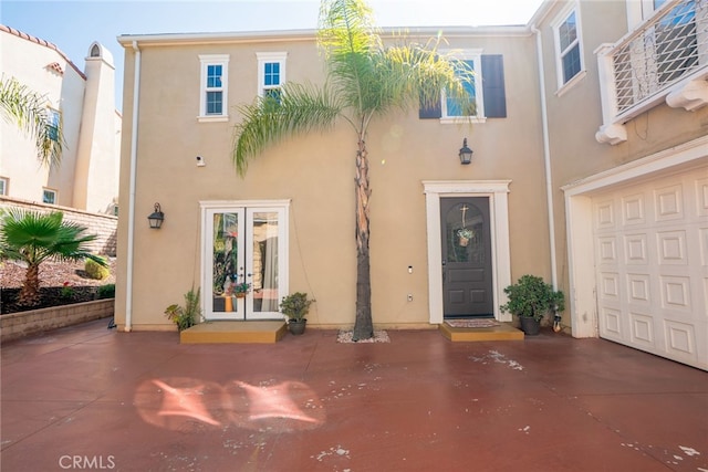 1550 Hibiscus Ave, Azusa, CA 91702 - doorway to property with french doors, driveway, a garage, and stucco siding