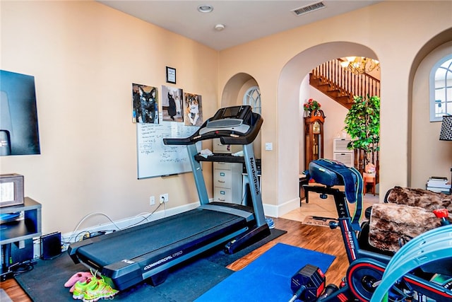 1550 Hibiscus Ave, Azusa, CA 91702 - exercise area featuring arched walkways, visible vents, and wood finished floors