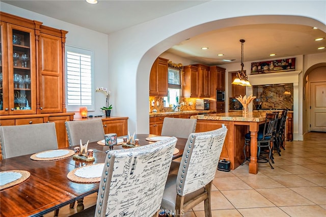 1550 Hibiscus Ave, Azusa, CA 91702 - dining area featuring recessed lighting, arched walkways, and light tile patterned flooring
