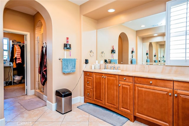 1550 Hibiscus Ave, Azusa, CA 91702 - full bath featuring vanity, tile patterned flooring, visible vents, and a wealth of natural light
