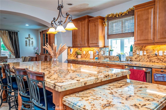 1550 Hibiscus Ave, Azusa, CA 91702 - kitchen with a center island, arched walkways, a wealth of natural light, and dishwasher
