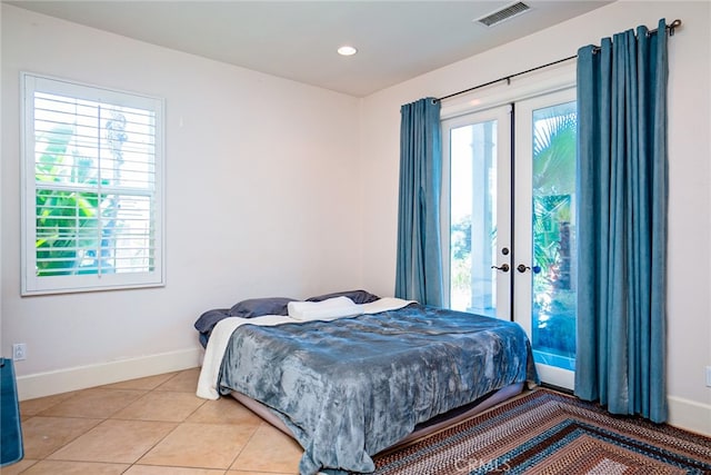 1550 Hibiscus Ave, Azusa, CA 91702 - bedroom with french doors, baseboards, access to outside, and visible vents