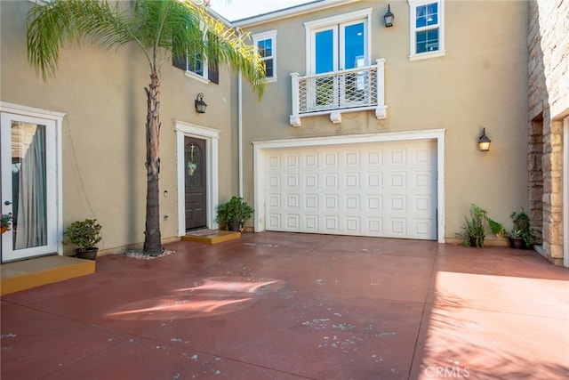 1550 Hibiscus Ave, Azusa, CA 91702 - view of front facade with driveway, a garage, and stucco siding