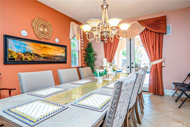 1550 Hibiscus Ave, Azusa, CA 91702 - tiled dining area featuring french doors, a wealth of natural light, a chandelier, and baseboards