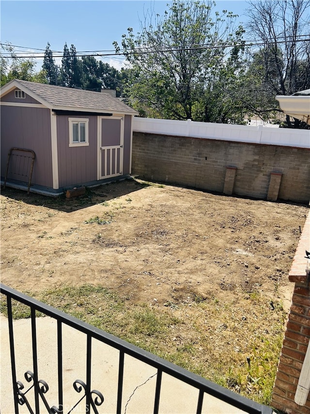 16624 Kelsloan St, Lake Balboa, CA 91406 - fenced backyard with an outdoor structure and a storage unit