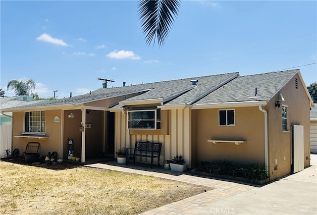 16624 Kelsloan St, Lake Balboa, CA 91406 - view of front of property featuring roof with shingles, stucco siding, and a front lawn