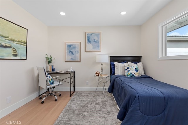 bedroom with light wood-style flooring, recessed lighting, and baseboards