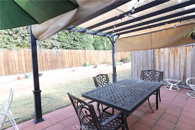 view of patio / terrace featuring a fenced backyard, outdoor dining area, and a pergola