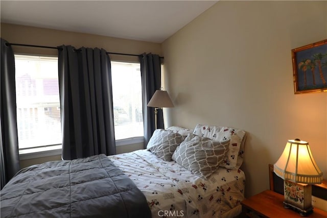 bedroom featuring multiple windows