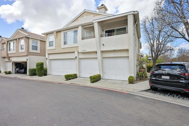 11869 Spruce Run Dr Unit B, San Diego, CA 92131 - view of property with stucco siding and a chimney