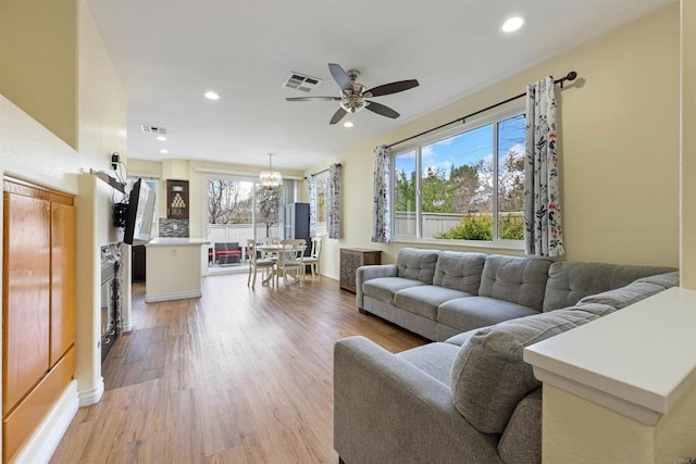11869 Spruce Run Dr Unit B, San Diego, CA 92131 - living room with ceiling fan, light wood-type flooring, recessed lighting, and a chandelier