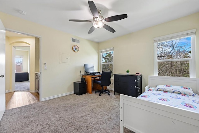 11869 Spruce Run Dr Unit B, San Diego, CA 92131 - carpeted bedroom featuring arched walkways, a ceiling fan, and an office area