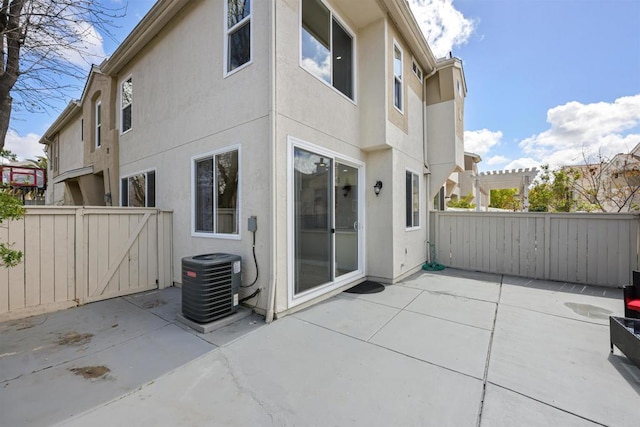 11869 Spruce Run Dr Unit B, San Diego, CA 92131 - back of property featuring stucco siding, a patio area, and a gate