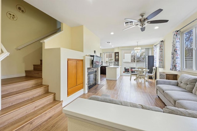 11869 Spruce Run Dr Unit B, San Diego, CA 92131 - living area featuring light wood-style flooring, stairs, ceiling fan, and recessed lighting