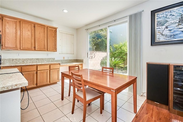 dining space featuring light tile patterned flooring and recessed lighting