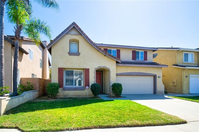 traditional-style home featuring stucco siding, fence, a front lawn, a garage, and concrete driveway