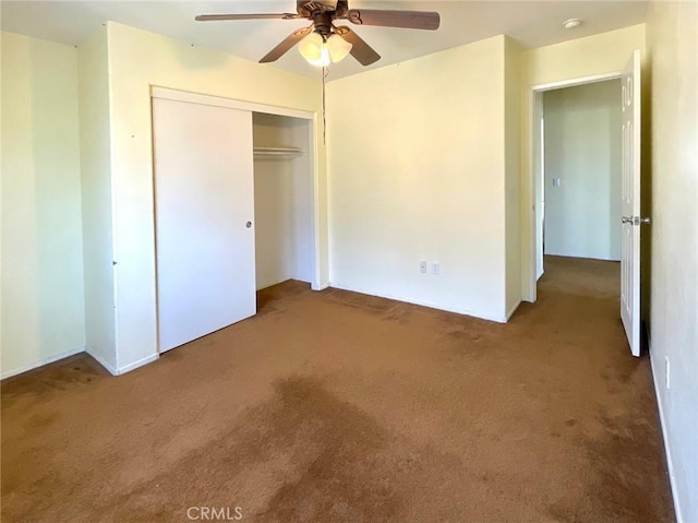 unfurnished bedroom with a closet, ceiling fan, and carpet