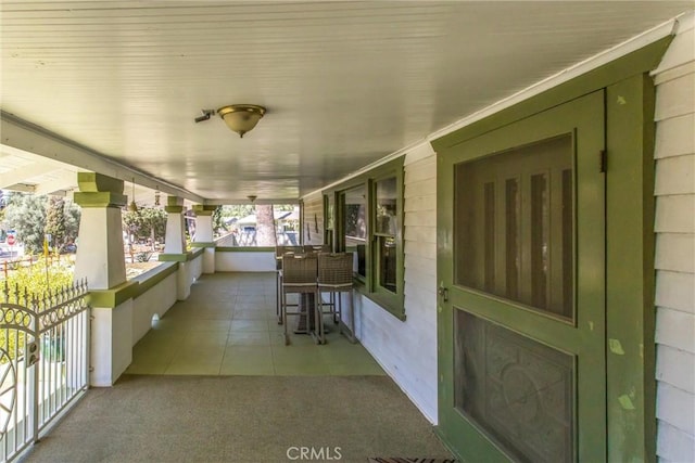 view of patio featuring a porch