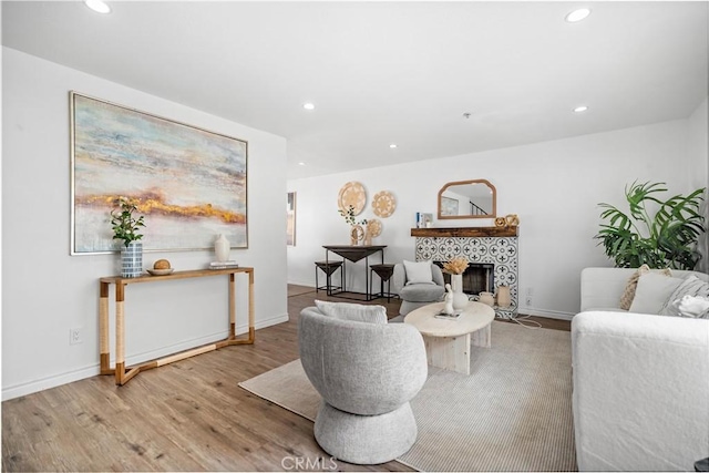 131 S Atlantic Blvd Unit A, Alhambra, CA 91801 - living room with recessed lighting, wood finished floors, a fireplace, and baseboards