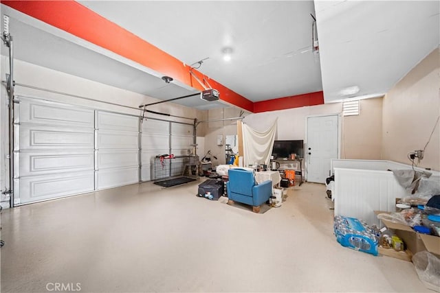 1010 W Wilson St, Pomona, CA 91768 - garage featuring a garage door opener