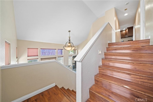 1010 W Wilson St, Pomona, CA 91768 - staircase featuring vaulted ceiling and wood finished floors