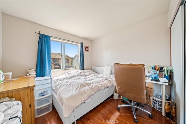 1010 W Wilson St, Pomona, CA 91768 - bedroom featuring dark wood-type flooring