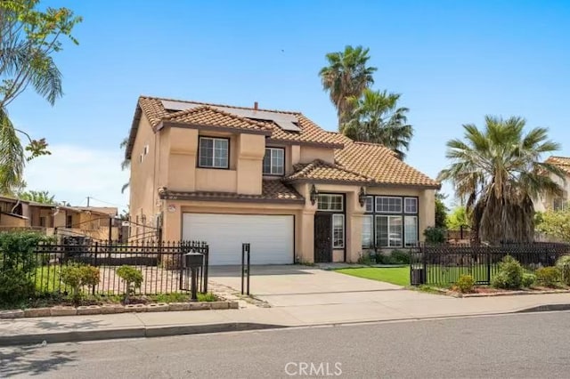 1010 W Wilson St, Pomona, CA 91768 - view of front of house with stucco siding, a tiled roof, a garage, and concrete driveway