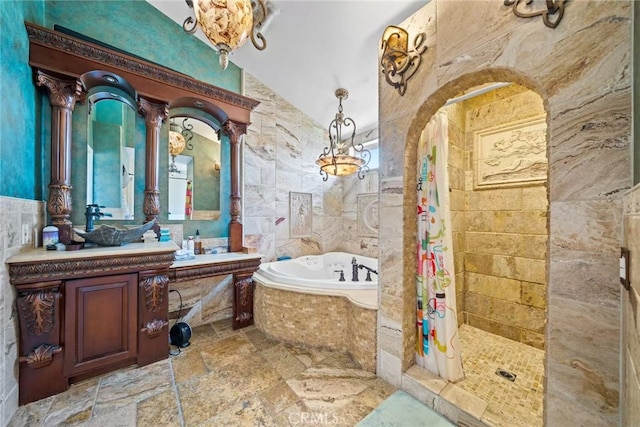 1010 W Wilson St, Pomona, CA 91768 - bathroom featuring a tile shower, vanity, stone tile flooring, a bath, and tile walls