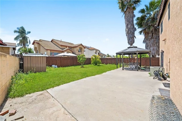 1010 W Wilson St, Pomona, CA 91768 - view of patio featuring a gazebo, a fenced backyard, and a storage shed
