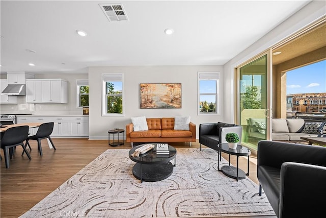 248 Keeper, Irvine, CA 92618 - living area featuring wood finished floors, recessed lighting, visible vents, and plenty of natural light