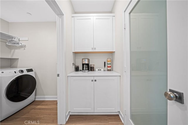 248 Keeper, Irvine, CA 92618 - laundry area featuring baseboards, light wood-style floors, washer / dryer, laundry area, and bar