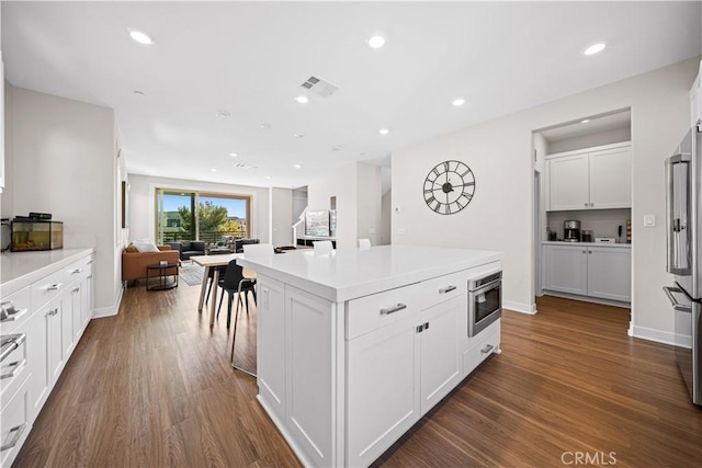 248 Keeper, Irvine, CA 92618 - kitchen with open floor plan, white cabinets, appliances with stainless steel finishes, and dark wood finished floors
