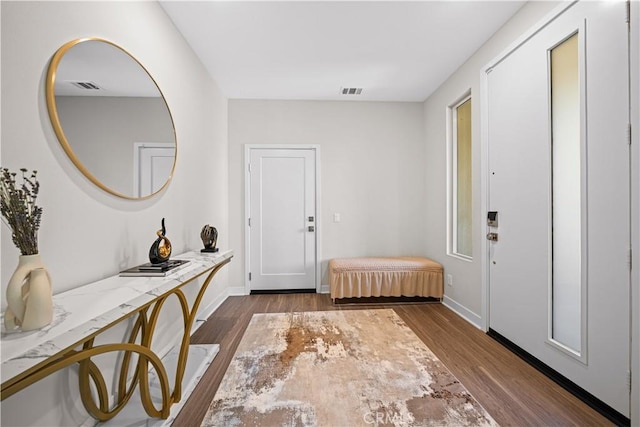 248 Keeper, Irvine, CA 92618 - entryway with dark wood-style flooring, baseboards, and visible vents