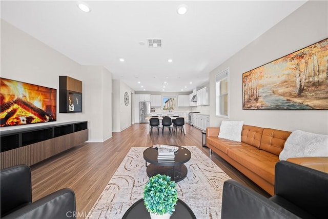 248 Keeper, Irvine, CA 92618 - living room with recessed lighting, light wood-style flooring, baseboards, and visible vents