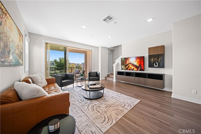 248 Keeper, Irvine, CA 92618 - living room with baseboards, recessed lighting, stairs, visible vents, and wood finished floors