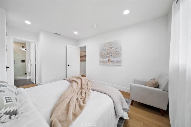bedroom with recessed lighting, baseboards, visible vents, and wood finished floors