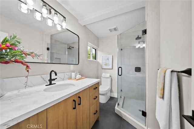 bathroom featuring vanity, a stall shower, toilet, and visible vents
