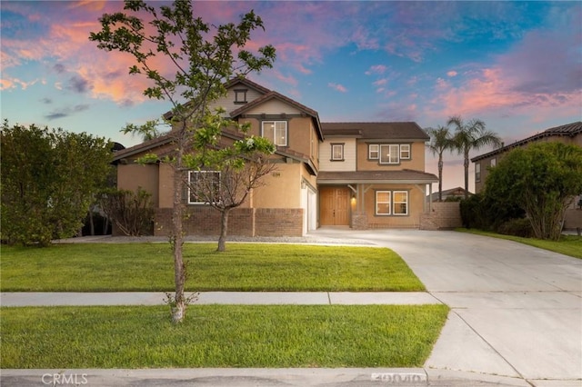 12949 Colonial Dr, Rancho Cucamonga, CA 91739 - view of front facade featuring a front lawn, stucco siding, and concrete driveway