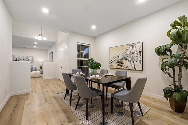 12949 Colonial Dr, Rancho Cucamonga, CA 91739 - dining room with light wood-style flooring, an inviting chandelier, baseboards, and recessed lighting