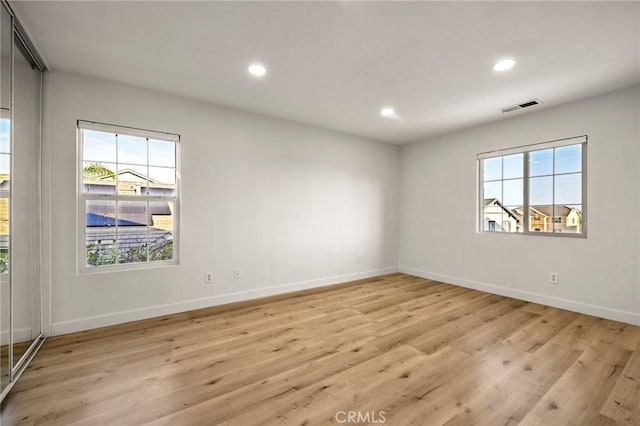 12949 Colonial Dr, Rancho Cucamonga, CA 91739 - empty room featuring light wood-style flooring, baseboards, and visible vents