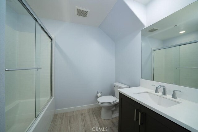 430 Transport, Tustin, CA 92782 - bathroom with toilet, vanity, wood finished floors, combined bath / shower with glass door, and baseboards