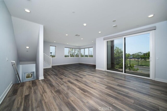 430 Transport, Tustin, CA 92782 - unfurnished living room featuring wood finished floors, baseboards, and recessed lighting