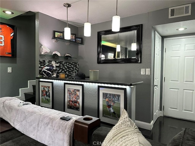 bar with visible vents, backsplash, stairway, and baseboards