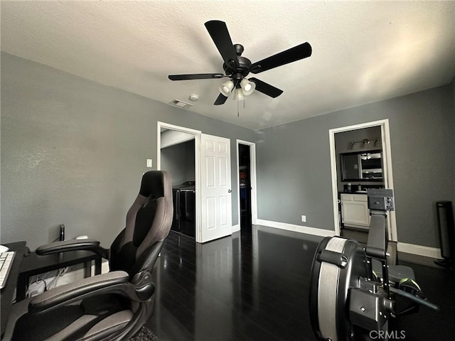 office featuring ceiling fan, baseboards, visible vents, and dark wood-style flooring