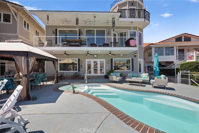 30594 Longhorn Dr, Canyon Lake, CA 92587 - rear view of house featuring ceiling fan, outdoor lounge area, a balcony, a gazebo, and a patio area