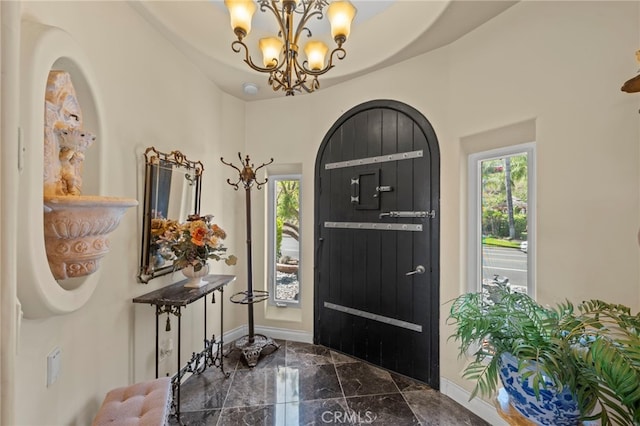 30594 Longhorn Dr, Canyon Lake, CA 92587 - entryway featuring marble tiled flooring, plenty of natural light, a chandelier, and baseboards